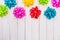 Colorful flora satin bows on wooden background with copy space