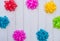 Colorful flora satin bows on wooden background with copy space