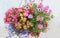 Colorful flower basket with petunias, lobelia, geranium and bidens