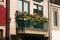 Colorful flowers on balcony of typical Portuguese house in Porto, Portugal