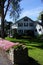 Colorful flowers and classic New England home