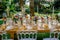 Colorful flowers decorating banquet table in tropical garden