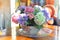 Colorful flowers are placed in the pot size cute table with the