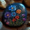 Colorful flowers at sunset on painted stone