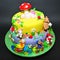 Colorful fondant cake with animals figurines