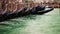 Colorful footage of Venecian gondolas rocking on the water