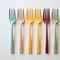 Colorful forks in various groups, arranged on a white background