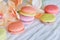 Colorful france macarons on white table background