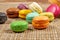 Colorful france macarons on wooden background - selective focus