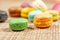 Colorful france macarons on wooden background - selective focus