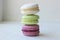 Colorful French or Italian macaroon stack cakes / Macaroon cakes. Assorted macaroon cakes stacked on top of each other on a light