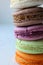 Colorful French or Italian macaroon stack cakes / Macaroon cakes. Assorted macaroon cakes stacked on top of each other on a light