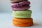 Colorful French or Italian macaroon stack cakes / Macaroon cakes. Assorted macaroon cakes stacked on top of each other on a light