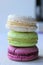 Colorful French or Italian macaroon stack cakes / Macaroon cakes. Assorted macaroon cakes stacked on top of each other on a light