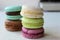 Colorful French or Italian macaroon stack cakes / Macaroon cakes. Assorted macaroon cakes stacked on top of each other on a light