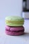 Colorful French or Italian macaroon stack cakes / Macaroon cakes. Assorted macaroon cakes stacked on top of each other on a light