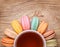 Colorful French Macarons with Cup of Tea