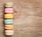 Colorful French Macarons on wood background