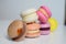 Colorful french macaroons  yellow,  brown,  pink, purple, white homemade or restaurant  cookies.  Sweets in different colours