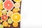 Colorful fresh citrus fruit on wooden background. Orange, tangerine, lime, blood orange, grapefruit. Fruit background. Summer foo