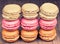 Colorful fresh delicious macaroons on wooden background