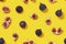 Colorful fresh figs fruit seamless pattern on bright yellow background, whole and sliced fig