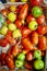 Colorful Fresh Heritage Tomatoes on Market Stall with Hard Light