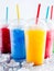 Colorful Frozen Fruit Slush Drinks in Plastic Cups