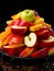 A Colorful Fruit Medley in a Ceramic Bowl. A bowl filled with sliced apples and sliced oranges