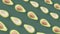 Colorful fruit pattern of fresh avocados on green background with shadows. Seamless pattern with avocado. Realistic