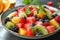 Colorful fruit salad, a medley of citrus, melons, and berries, bursting with freshness.