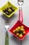 Colorful fruits olives bowls wooden table cutlery