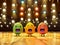 Colorful funny Easter eggs sing a song on stage against the background of bright spotlig