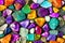 Colorful gems background, many multicolored gems as a background pattern