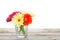 Colorful gerbera flowers on wooden table