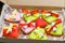 Colorful gingerbread cookies tied with ribbons in the box