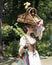 A colorful girl dressed in medieval costume with basket of flowers at the annual Bristol Renaissance Faire