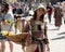 A colorful girl dressed in medieval costume with basket of flowers at the annual Bristol Renaissance Faire