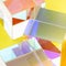 Colorful glass cubes on yellow background