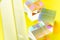 Colorful glass prisms on yellow background