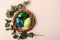 Colorful glossy easter eggs in the rattan nest.Natural eucalyptus branch on the back.Happy easter or thanksgiving day concept