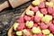 Colorful gnocchi hearts on a old table with rolling pin