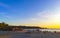 Colorful golden sunset people wave and beach Puerto Escondido Mexico