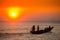 Colorful golden Sunset on Sea. Fishermans are returning home with fish, manually at sunset on Char Samarj beach at Chandpur,