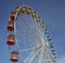 Colorful gondolas of an amusement park Ferris wheel