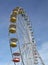 Colorful gondolas of an amusement park Ferris wheel