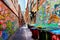 Colorful graffiti on brick walls in an alley in Melbourne, Australia