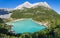 Colorful green water of lake Sorapis in italian dolomite landscape