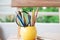 Colorful group of pencil with notebook on wood table