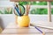 Colorful group of pencil with notebook on wood table